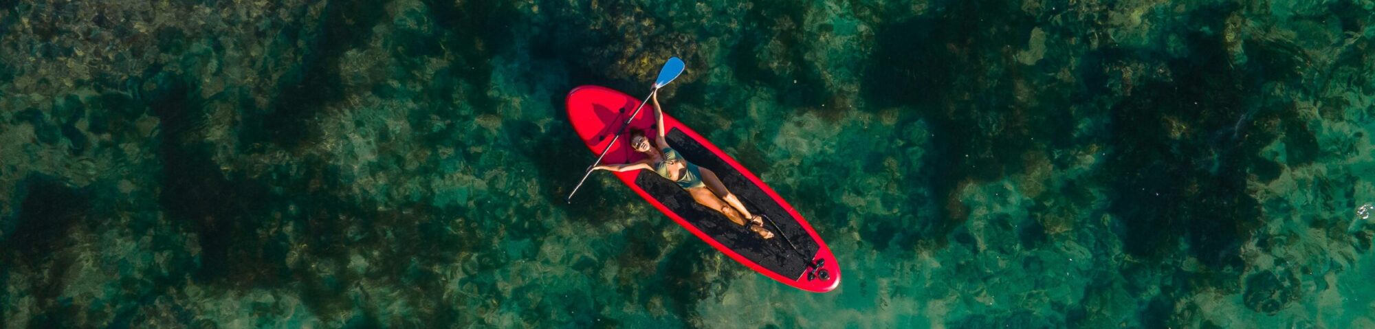 A woman enjoying SUP and freedom